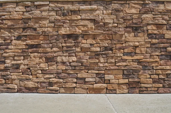 Brick Wall and Sidewalk