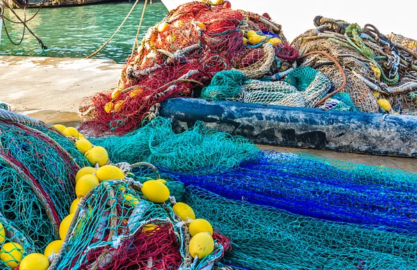 Brightly colored fish nets in a Mediterranean port
