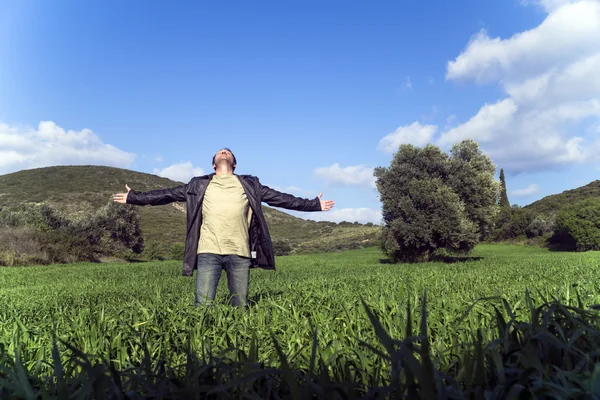 Young man greets the nature