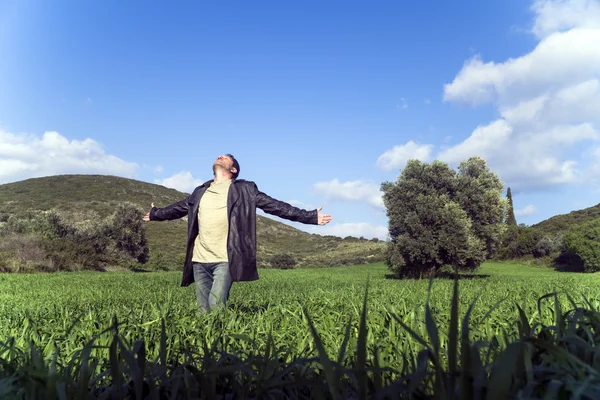 Young man greets the nature