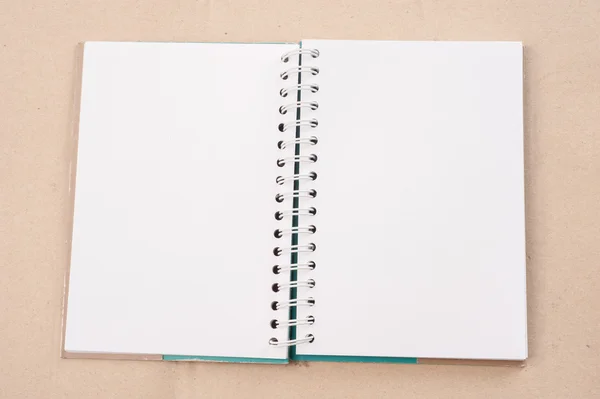 Open diary or photo album book on brown backgroun
