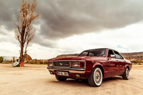 GOREME, TURKEY- APR 13, 2016: The vintage red car near Goreme vi