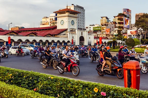 HO CHI MINH, VIETNAM - JAN 14, 2016: Architecture and motorbikes traffic on the street in Hochiminh (Saigon) on the sunset. Saigon is the largest city in Vietnam