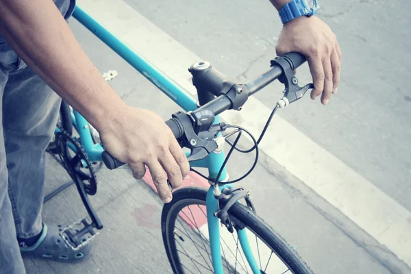 Hand with bike