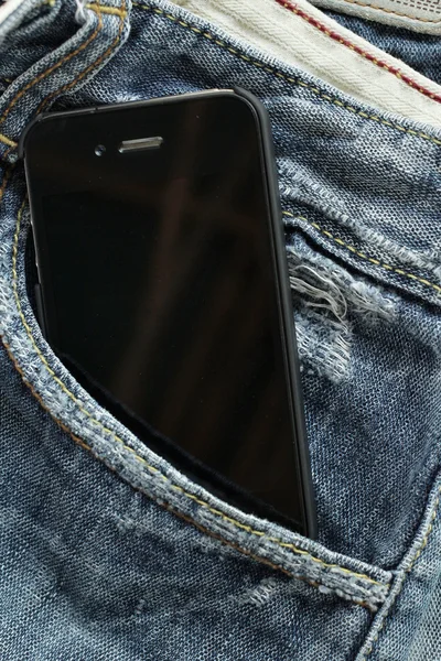 Smart phone in jeans pocket