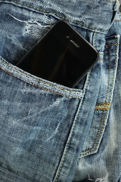 Smart phone in jeans pocket