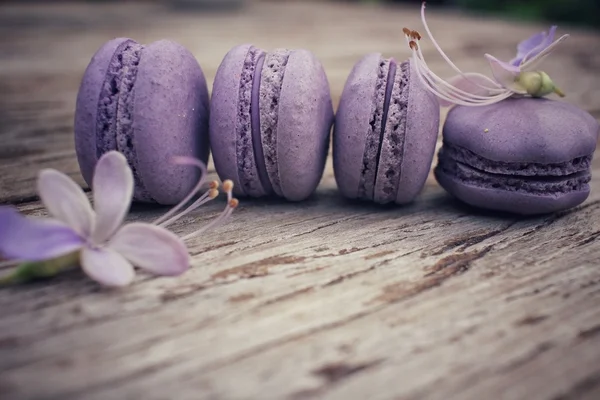 French macaroons with purple flowers