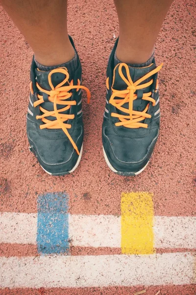 Selfie of sport shoes on track