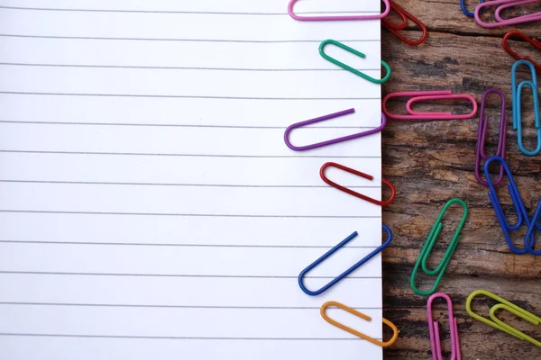 Paper notes with colorful paper clips