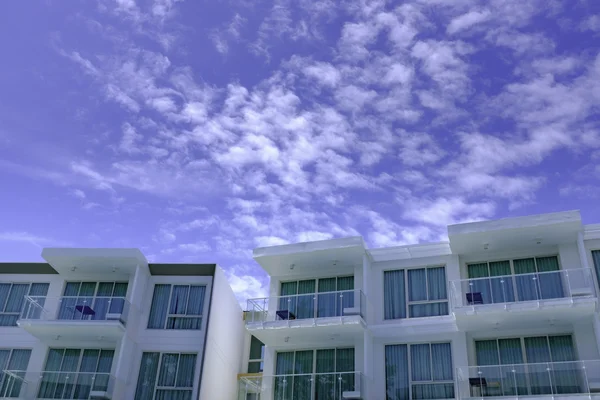 Facade of modern low rise architecture in blue sky