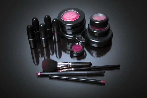 Various makeup products in pink tone