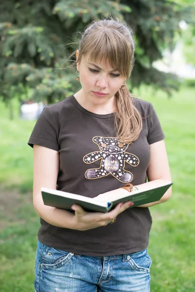 Group of Teenage Students at Park with Computer and Books