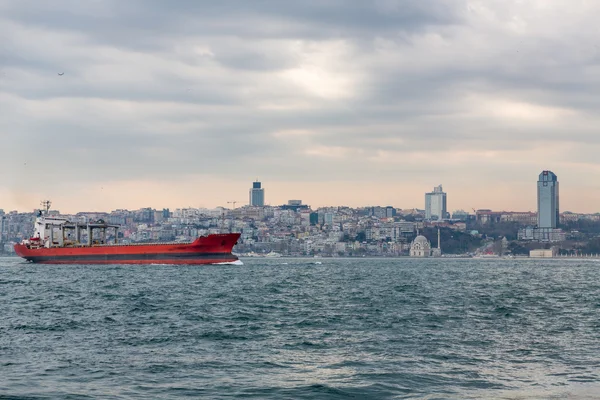 Bosphorus with buildings and cargo ship, Istanbul