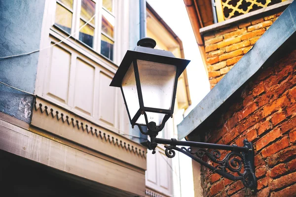Traditional forged iron lamp on the street of Kalaubani area in Old Tbilisi