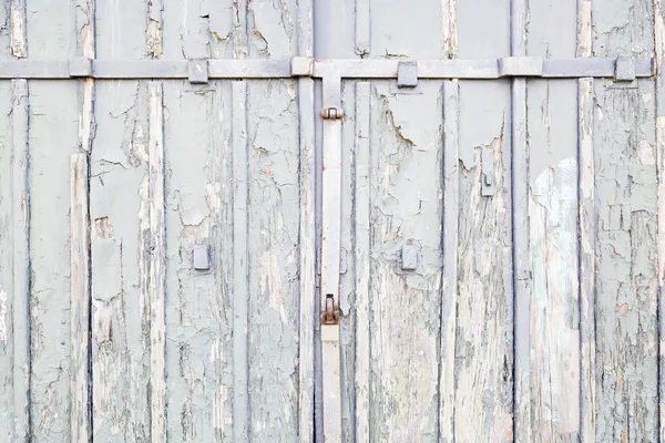 Abandoned Wooden gray door