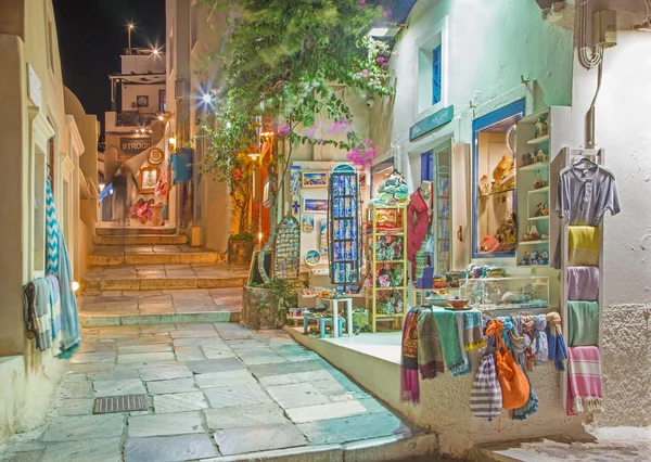 SANTORINI, GREECE - OCTOBER 4, 2015: The street of Oia with the souvenirs shops and restaurants at night.