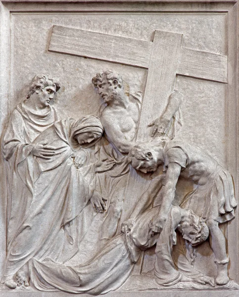 BRUSSELS, BELGIUM - JUNE 15, 2014: Stone relief Jesus fall under cross in church Notre Dame du Bon Secource (The Church of Our Lady of Assistance).