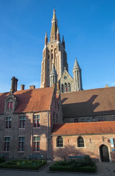 Bruges - Church of Our Lady from yard of Saint John Hospital (Sint Janshospitaal) in evening light