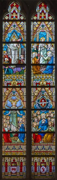 BRUGGE, BELGIUM - JUNE 12, 2014: The Ascension of Jesus and Pentecost, and Resurrection scene on the windowpane in st. Jacobs church (Jakobskerk).