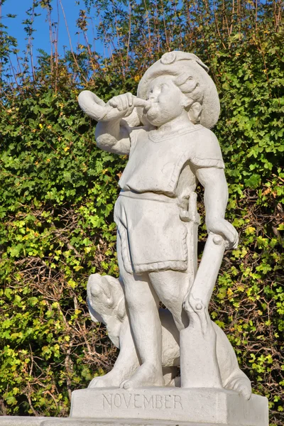 Vienna - The symbolic sculpture of november month in the gardens of Belvedere palace.
