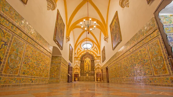 SEVILLE, SPAIN - OCTOBER 28, 2014: The corridor of Gothic palace in Alcazar of Seville.