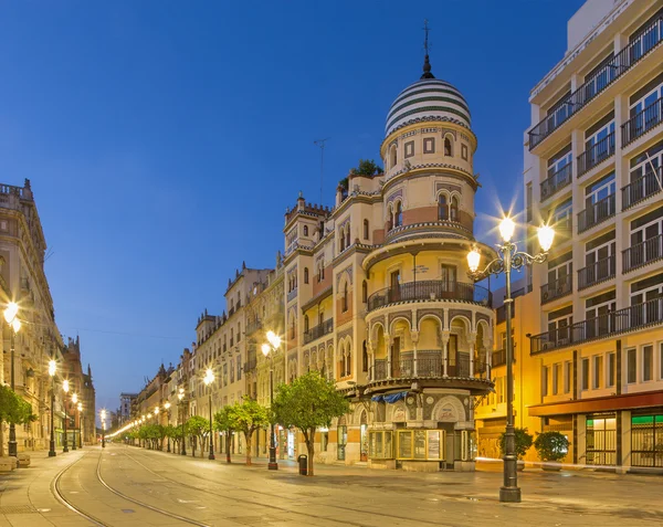 SEVILLE, SPAIN - OCTOBER 29, 2014:  The building in the neo-mudejar style on Avenida de la Constitucion street in morning dusk.