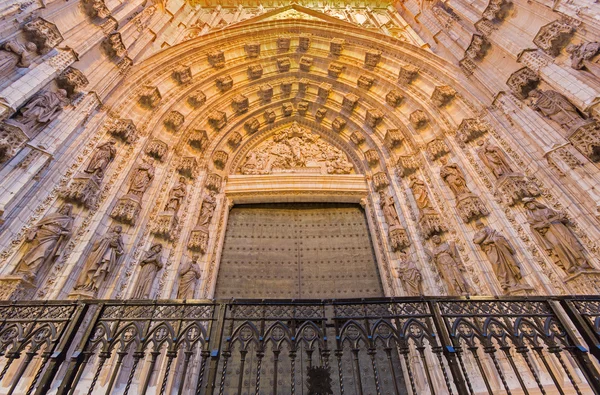 SEVILLE, SPAIN - OCTOBER 28, 2014: The main west portal (Puerta de la Asuncion) of Cathedral de Santa Maria de la Sede by Pedro de Toledo, J. de Hoces, F.de Rosales for neo-gothic part.