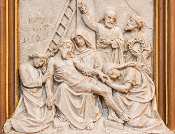 VIENNA, AUSTRIA - DECEMBER 17, 2014: The Jesus is taken down from the cross relief as one part of Cross way cycle in Sacre Coeur church by R. Haas from end of 19. cent.