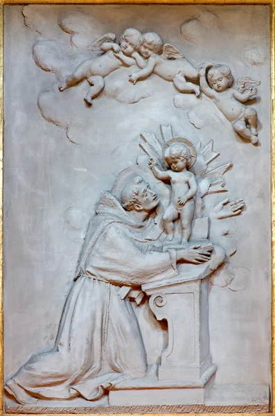 BOLOGNA, ITALY - MARCH 17, 2014: Relief of st. Anthony of Padoua in baroque church Chiesa Corpus Christi.
