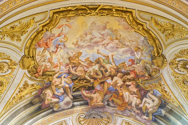 ROME, ITALY - MARCH 25, 2015: The ceiling fresco of The Fall of the Rebelious Angels (Caduta degli Angeli ribelli) in church Basilica dei Santi XII Apostoli by  Giovanni Odazzi (1663 - 1731).