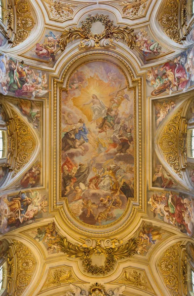 ROME, ITALY - MARCH 25, 2015: The ceiling fresco (Triumph of Franciscans order - Trionfo dell\'Ordine) by Francescano del Baciccio (1707) in church Basilica dei Santi XII Apostoli .