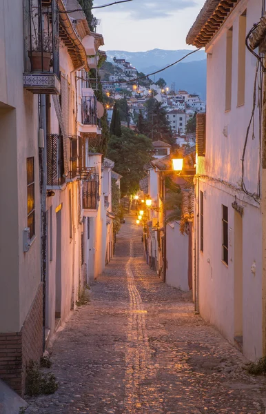 Granada - The ascent to Alhambra palace across the old street in morning dusk.