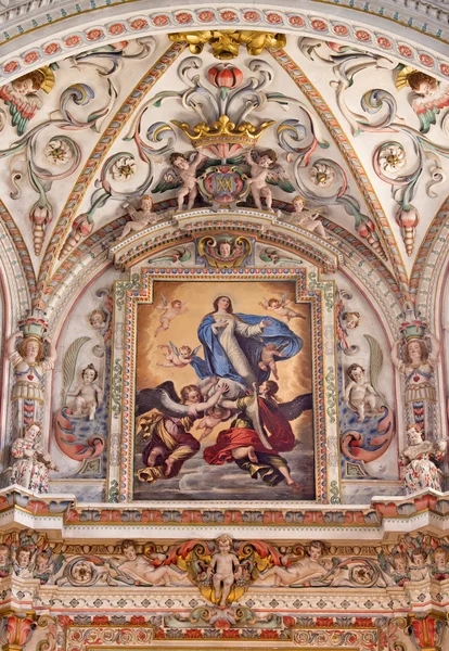 GRANADA, SPAIN - MAY 31, 2015: The detail of fresco in baroque sanctuary  in church Monasterio de la Cartuja with The Assumption of the Virgin painting by Pedro Atanasio Bocanegra (17. cent.)