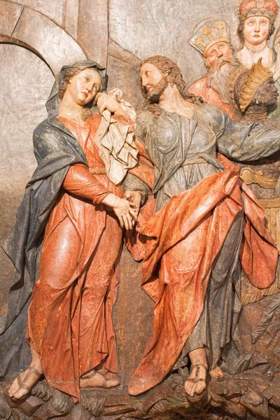 BANSKA STIAVNICA, SLOVAKIA - FEBRUARY 5, 2015: The detail of carved relief Jesus says farewell to his mother as the part of baroque Calvary from years 1744 - 1751 by Dionyz Stanetti.