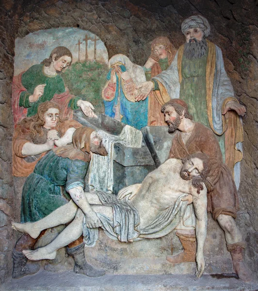 BANSKA STIAVNICA, SLOVAKIA - FEBRUARY 19, 2015: The detail stone relief of Burial of Jesus as the part of baroque Calvary from years 1744 - 1751.