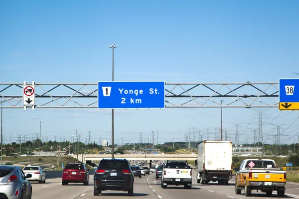 DRIVING ON HIGHWAY 7, June 29, 2016: A street sign for the  Yong Street on Highway 7 in Toronto Ontario.