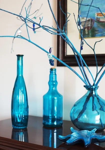Still life with bottles in blue tones. Interior decoration object