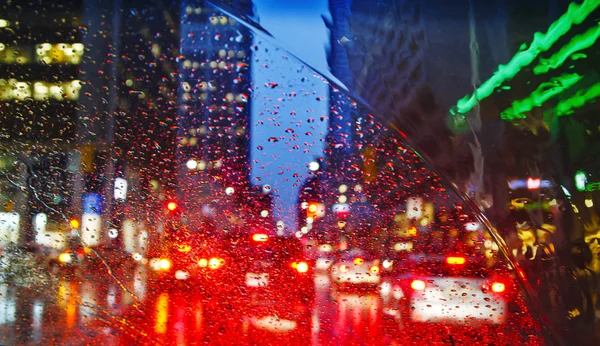 Night city through windshield. Street Bokeh Lights Out Of Focus.