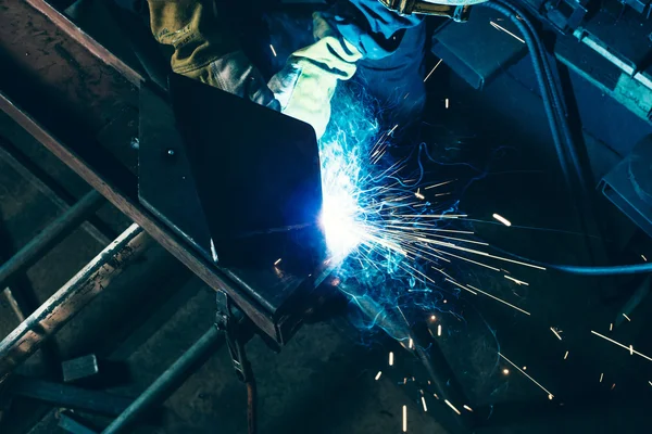 Gleaming piece of metal being welded