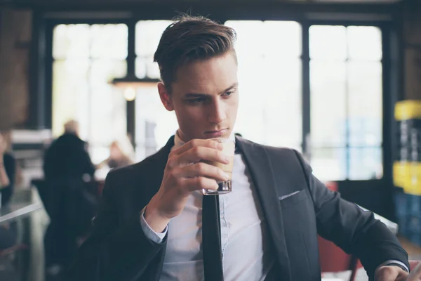 Single man drinking coffee in cafe