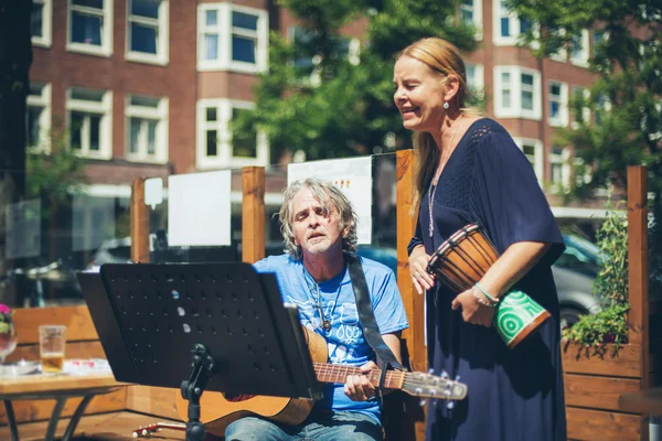 Street musicians performing acoustic