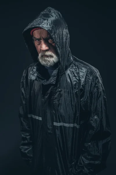 Half Body Shot of a Serious Bearded Senior Man