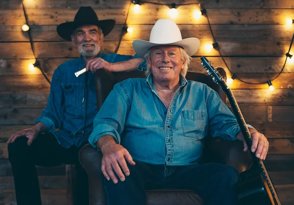 Two smiling  country and western musicians