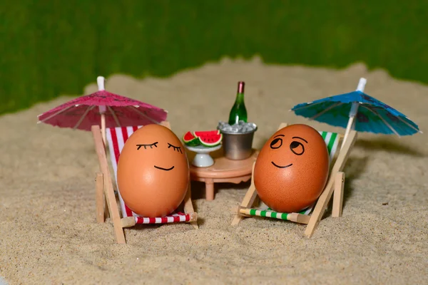 Easter funny eggs under umbrella
