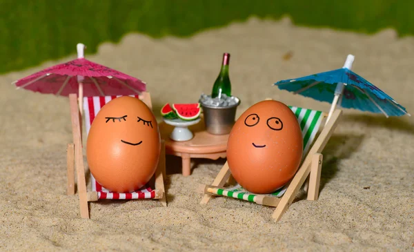 Easter funny eggs under umbrella