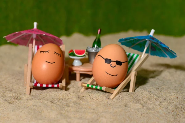Easter funny eggs under umbrella
