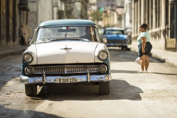 HAVANA,CUBA-OCTOBER 13:People and old car on streets of Havana O