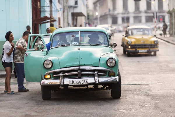 HAVANA,CUBA-OCTOBER 14:People and old car on streets of Havana O