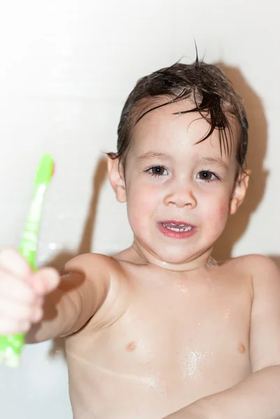 Little boy brush teeth.