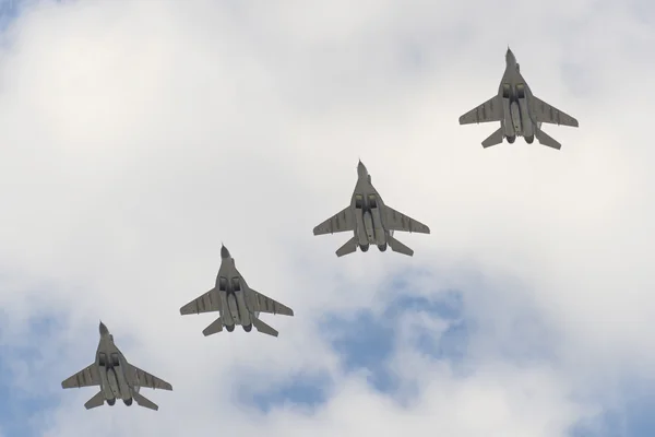 Four military aircraft MiG-29 flying over the Red Square